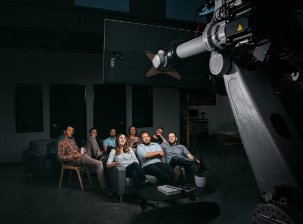 Loupe team watching a movie on a robot arm