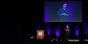 Shawn Busse speaking on stage