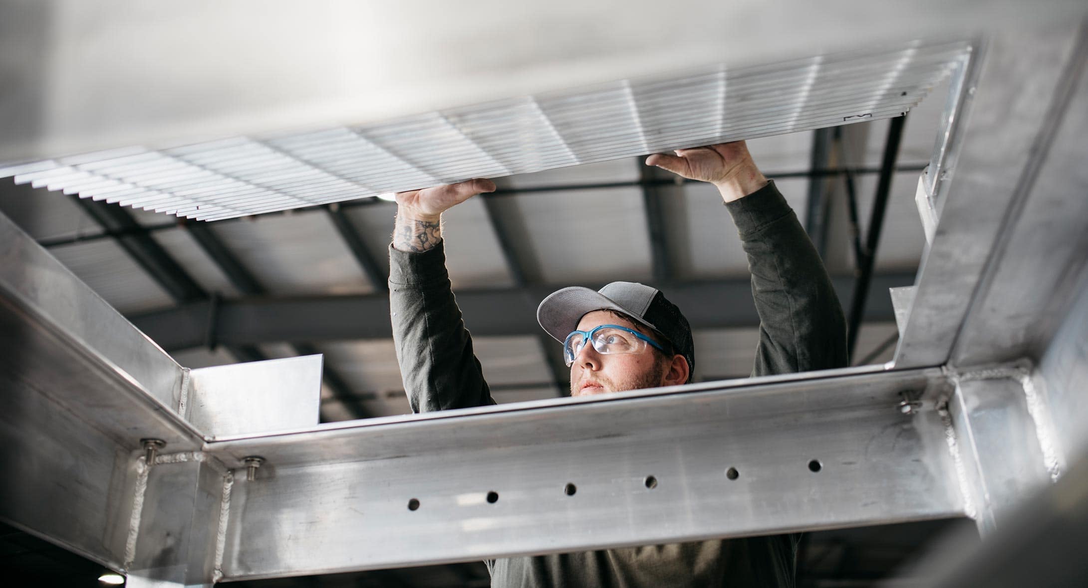 Solid Form Employee Inspecting Catwalk