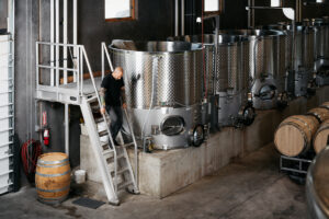 President Deven Paolo descending a metal staircase produced by Solid Form at a winery