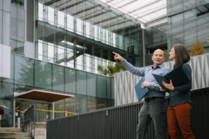 Systems West team members discussing building exterior