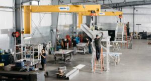 Production floor at Solid Form in warehouse with employees and big machinery