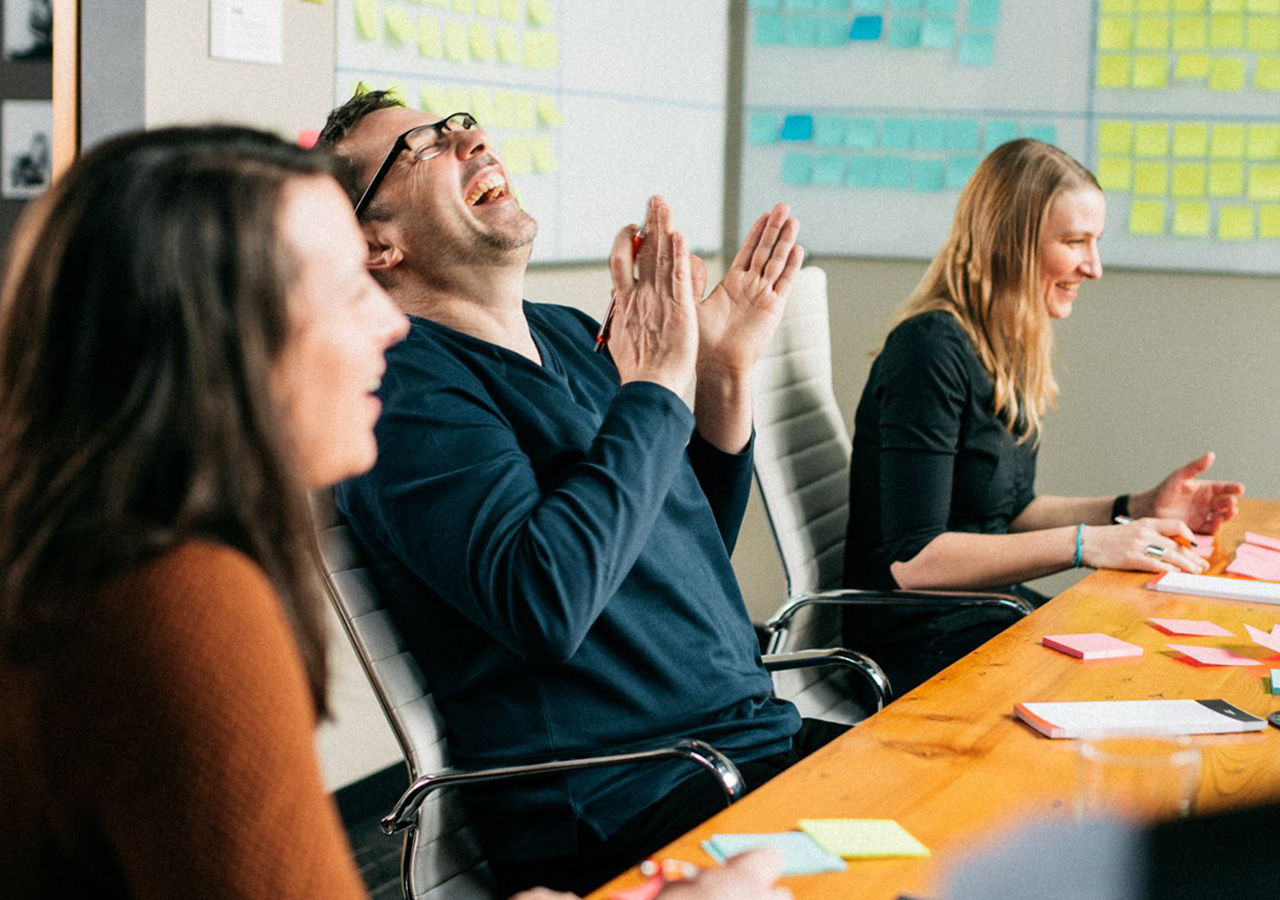 shawn-laughing-kinesis-conference-table